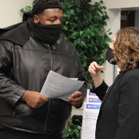 Faculty discusses with student